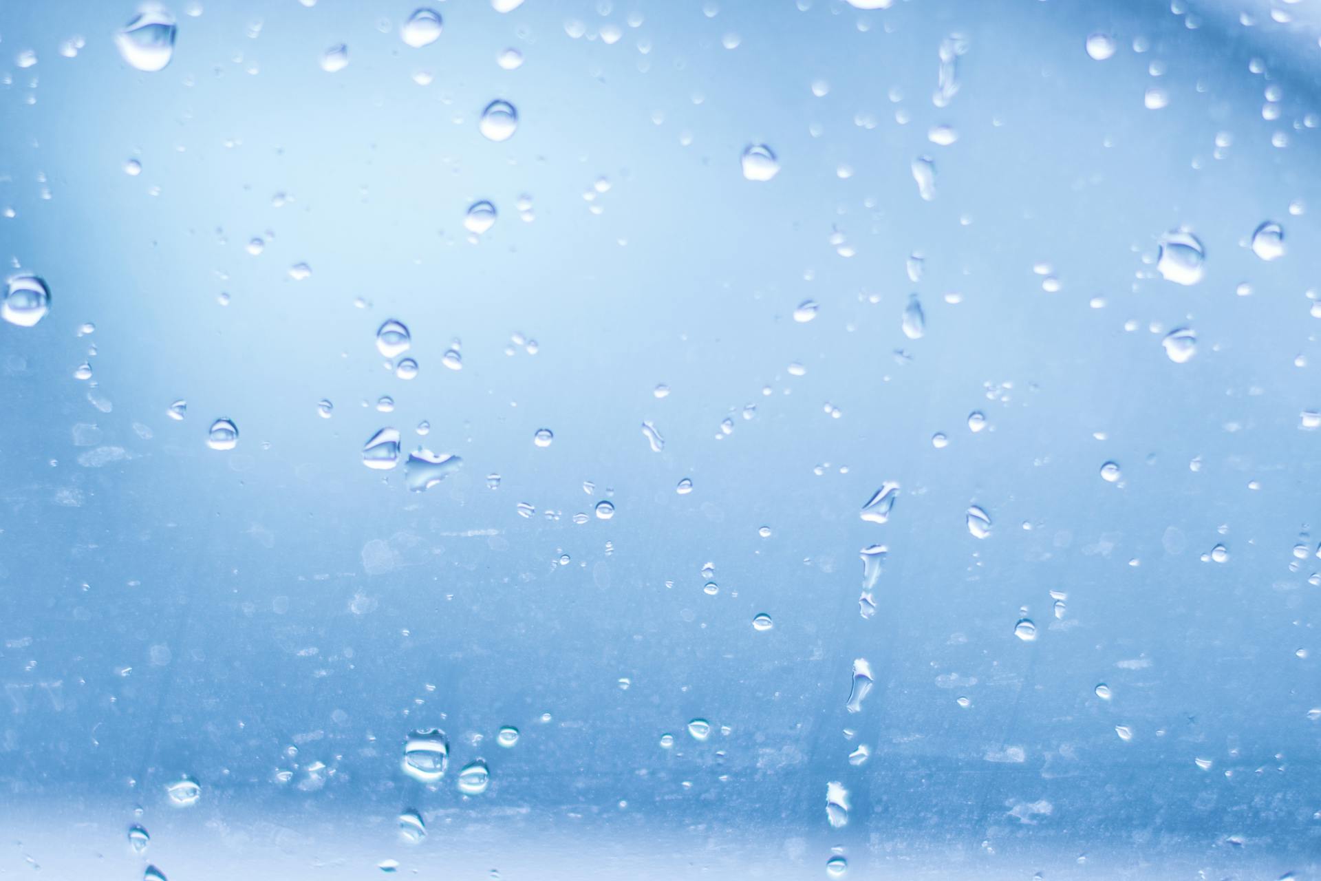 Close-up of Water Droplets Against Blue Background