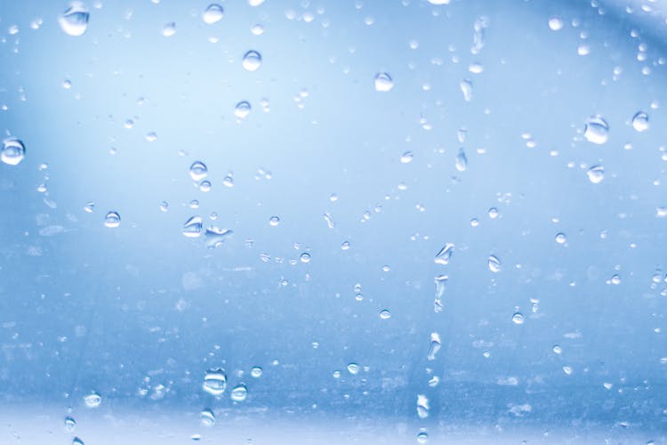 Close-up Of Water Droplets Against Blue Background