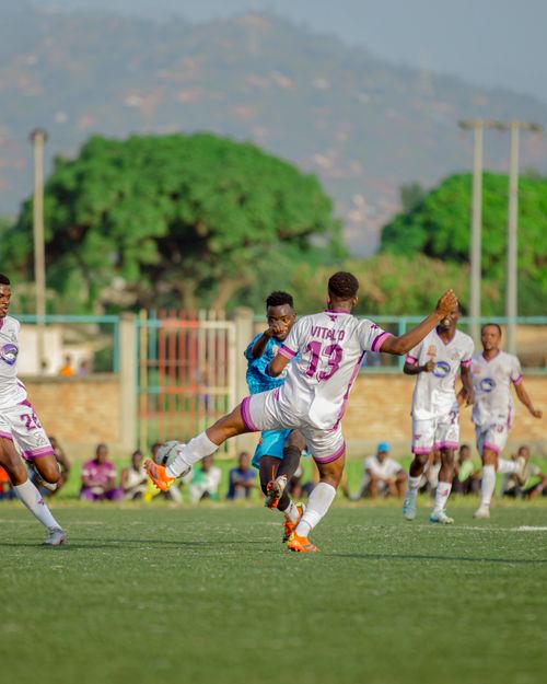 Free Soccer players in action during a lively outdoor match on a sunny day. Stock Photo