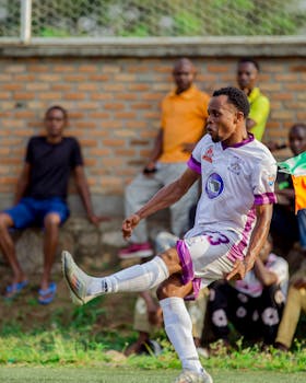 Dynamic action shot of a soccer player in motion, capturing intensity and excitement on the field.
