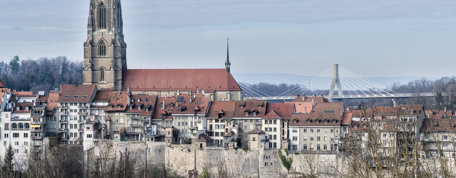 Scenic view of Fribourg's historic architecture and iconic cathedral in Switzerland.