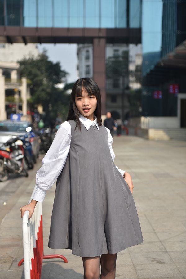Woman in corduroy pinafore dress