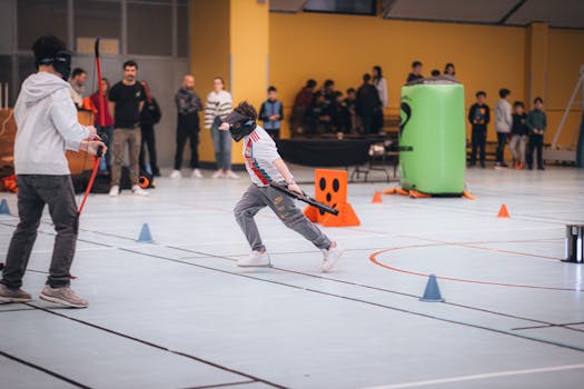 Children participate in an indoor archery game, showcasing sporting activity and teamwork.