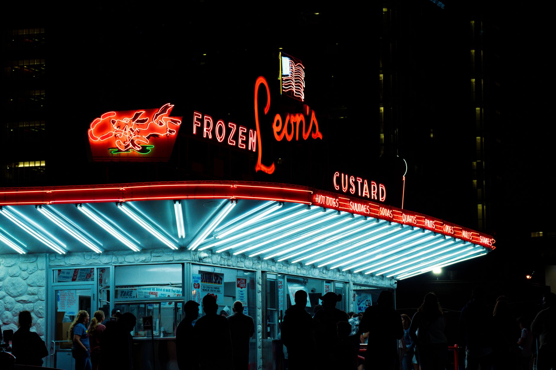 Frozen custard served in waffle cones with chocolate drizzle