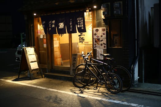 Bicycles parked outside a traditional Japanese restaurant in Fukuoka city, Japan.