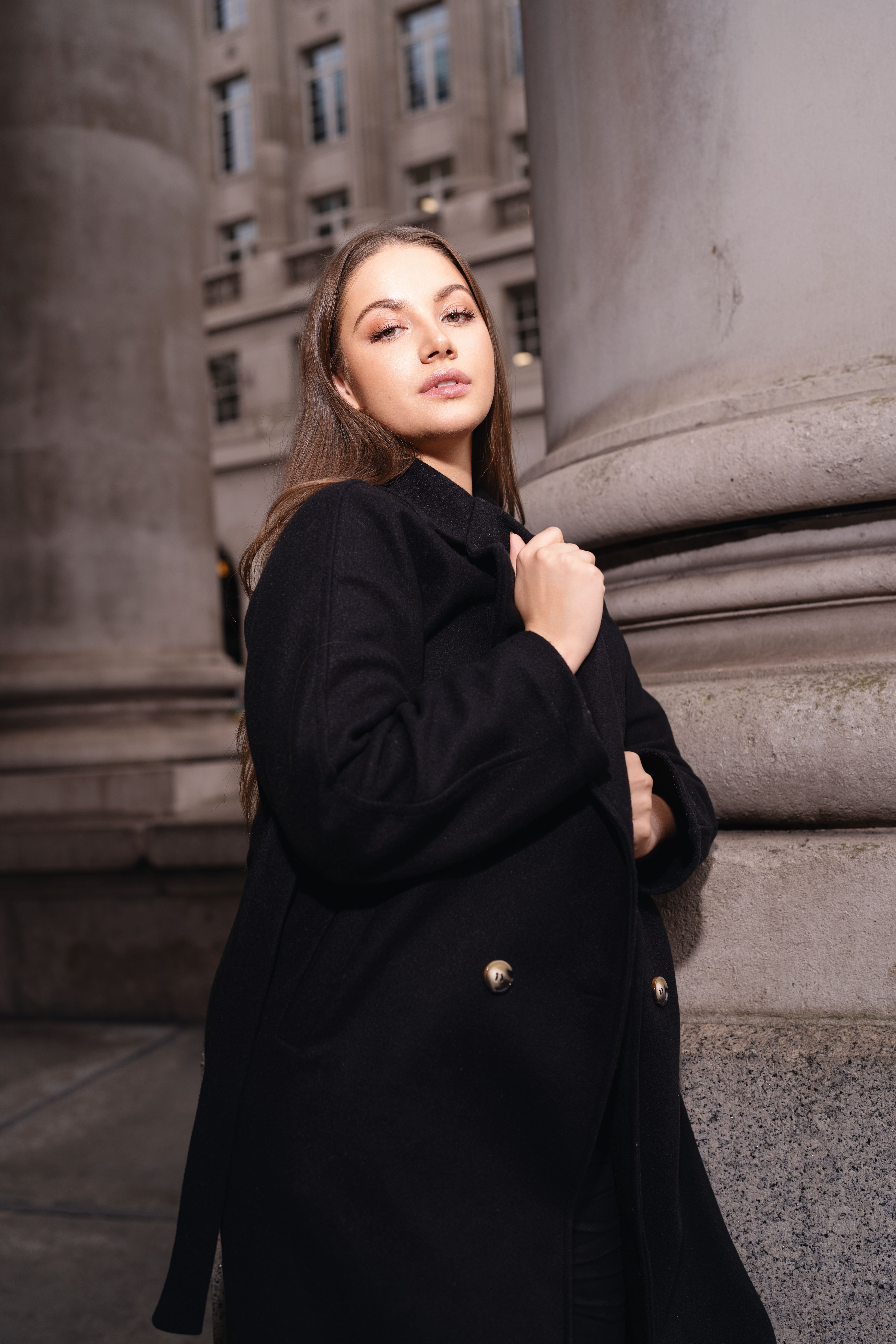 Woman in textured black winter outfit
