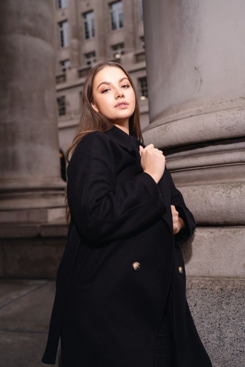 Woman in textured black winter outfit