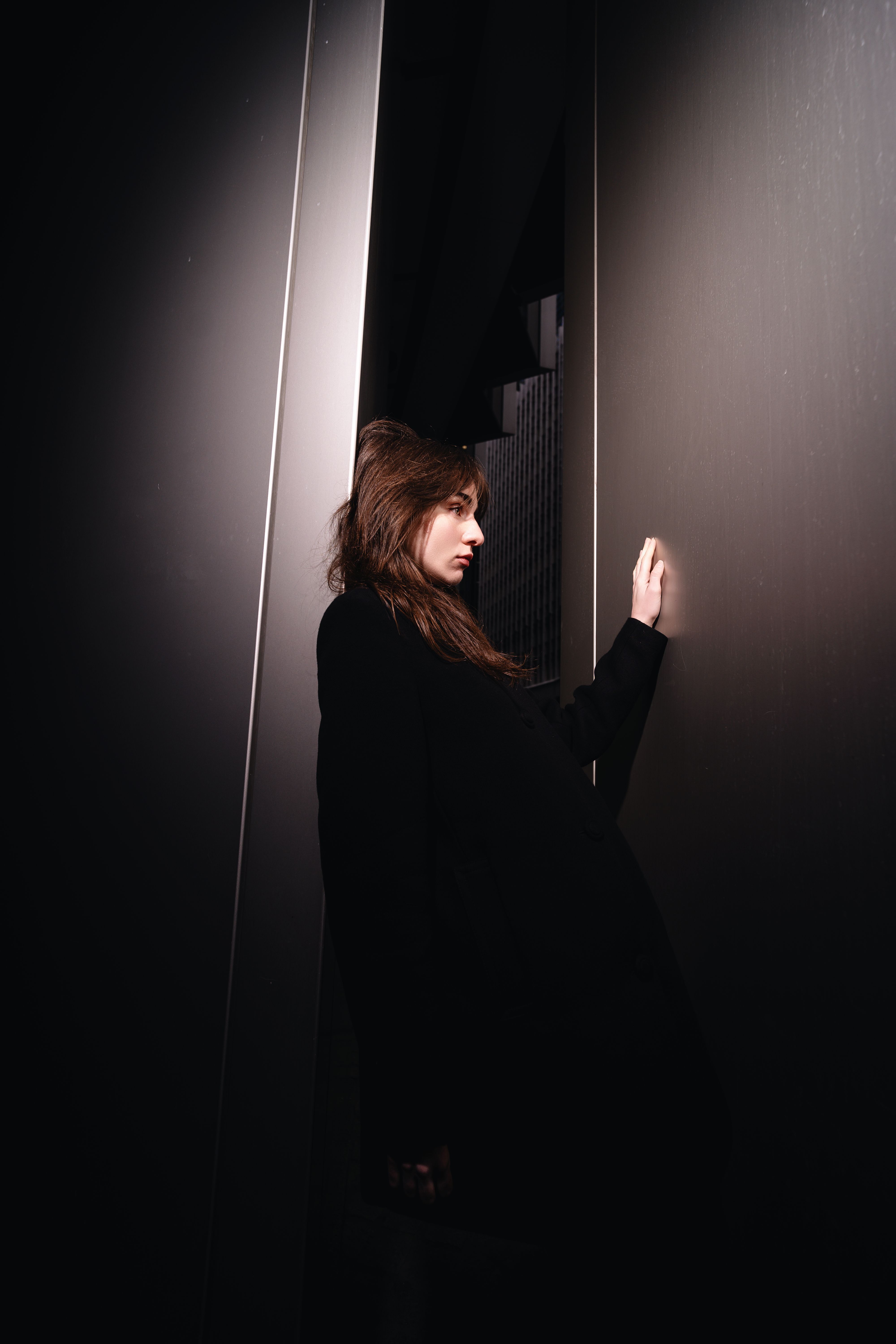 Stylish Woman Posing in Modern Architectural Setting · Free Stock Photo