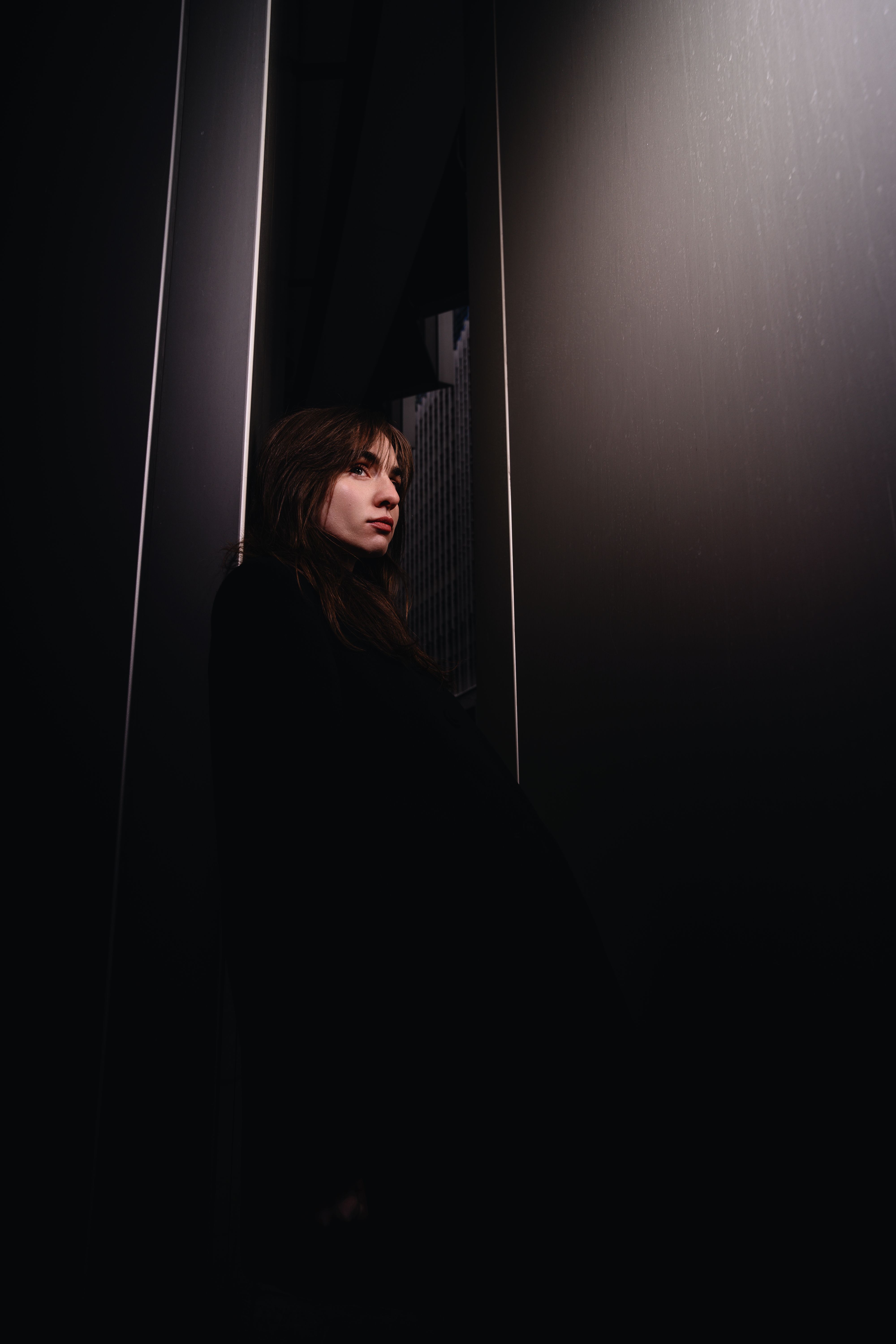 Dramatic Portrait of a Woman in Dark Setting · Free Stock Photo