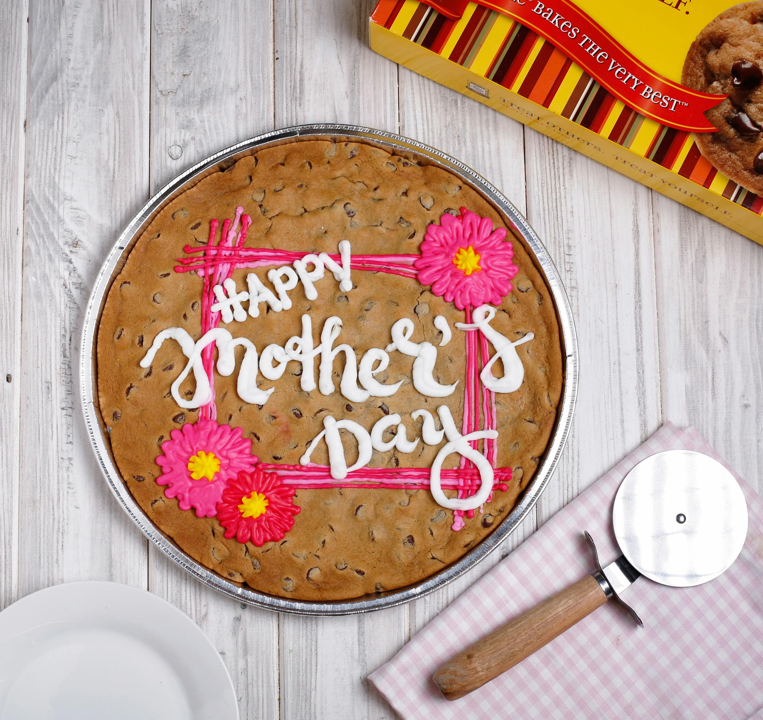 Happy Mother's Day cake with cake cutter alongside