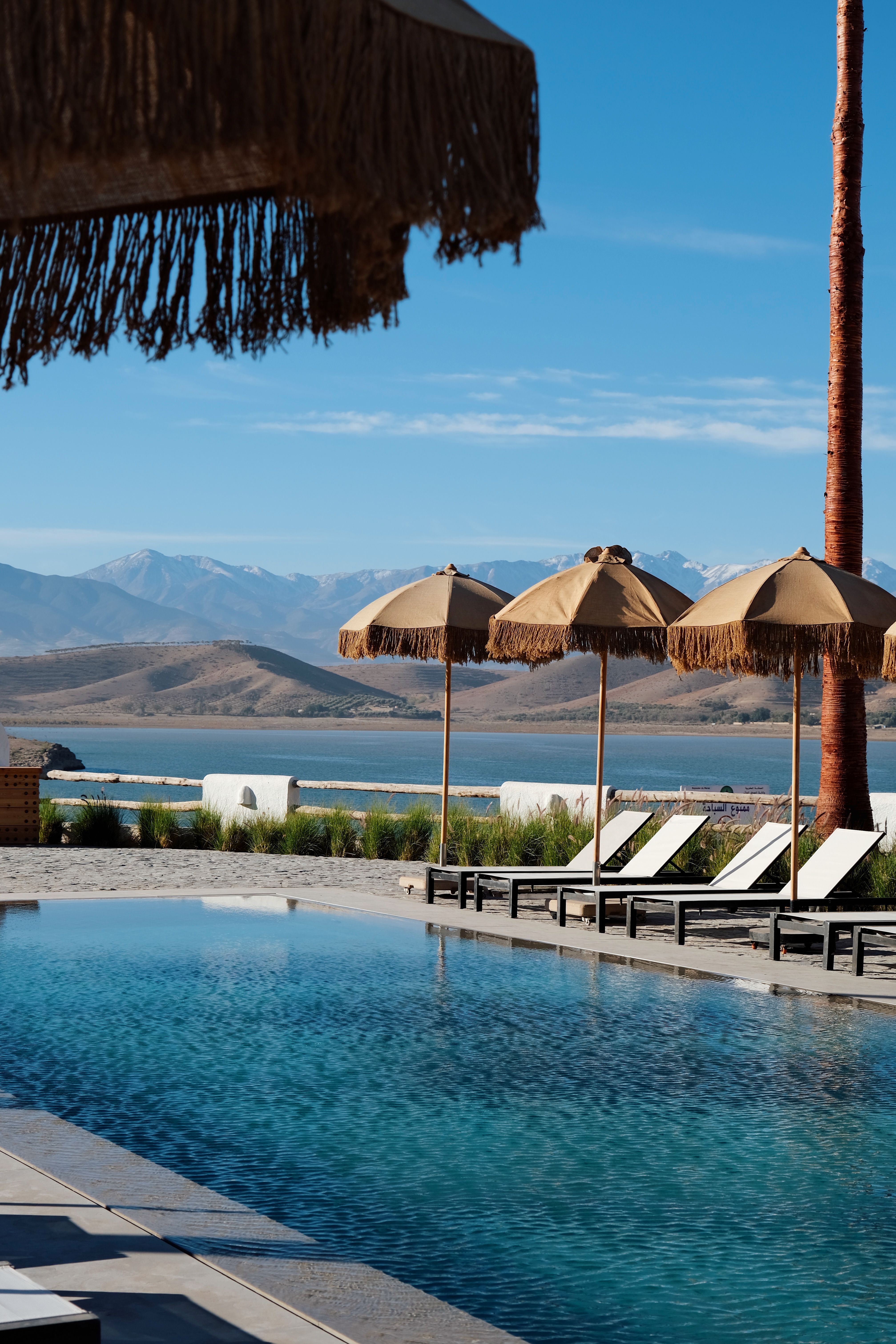 Tranquil poolside setting with mountain views in Aguergour, Morocco.