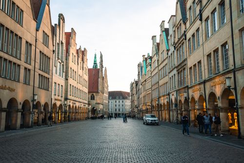 Free Charming street view of the Prinzipalmarkt in Münster, Germany at dusk with historic architecture. Stock Photo