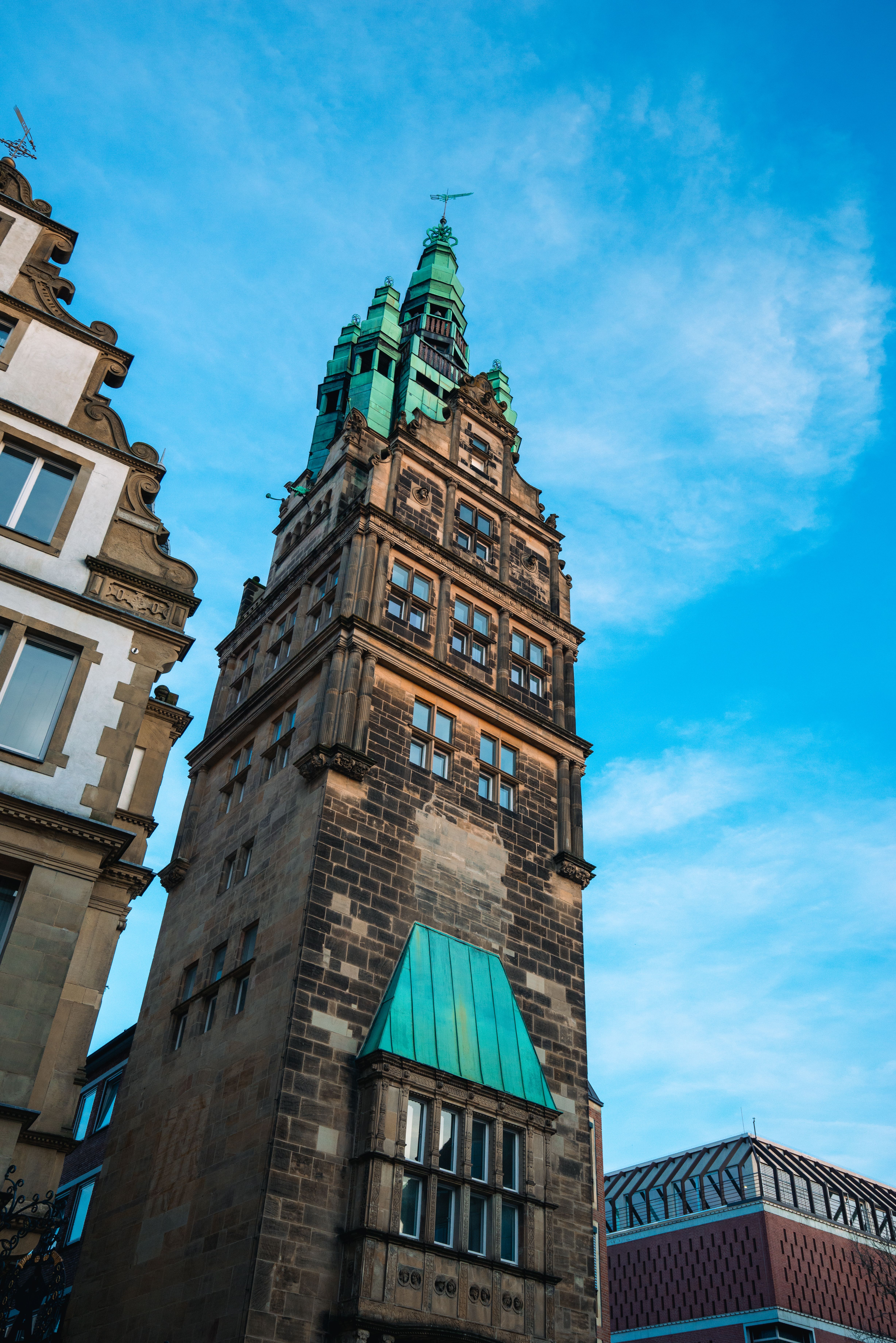 Historic Brick Building with Tower against Blue Sky · Free Stock Photo