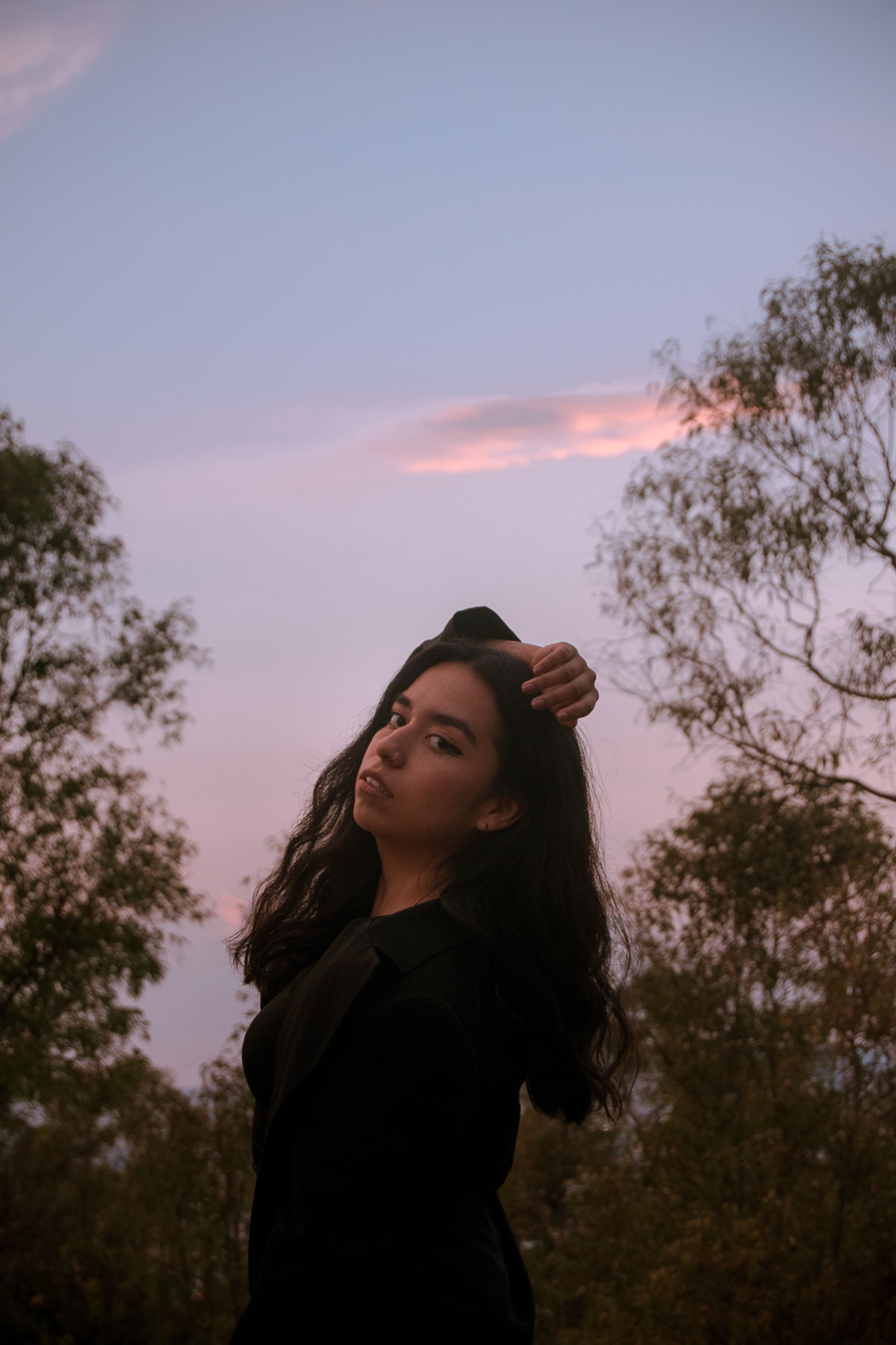 Serene Portrait of Woman at Sunset Outdoors · Free Stock Photo