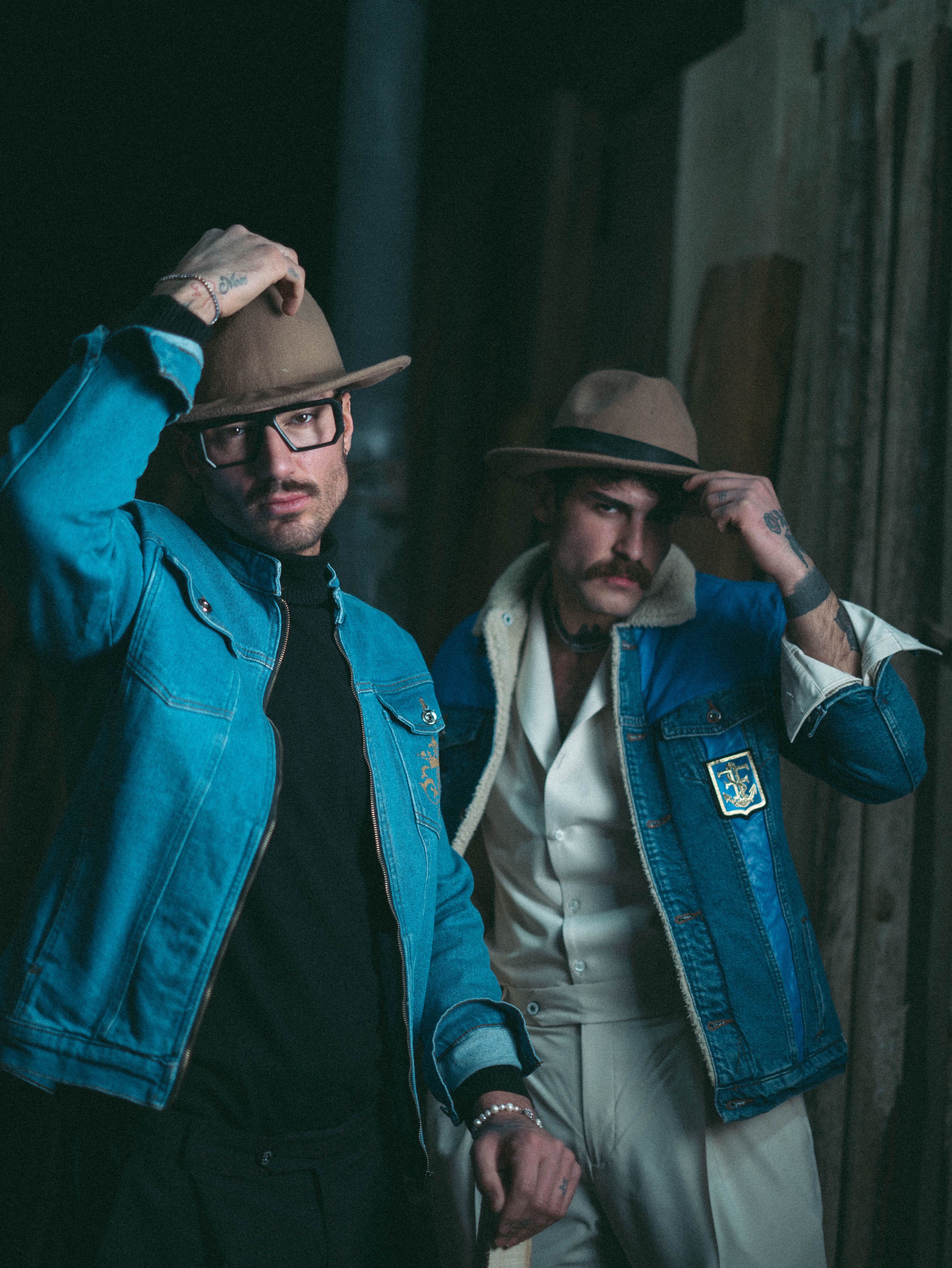 Men in denim jackets and hats from a menswear store in Kolkata