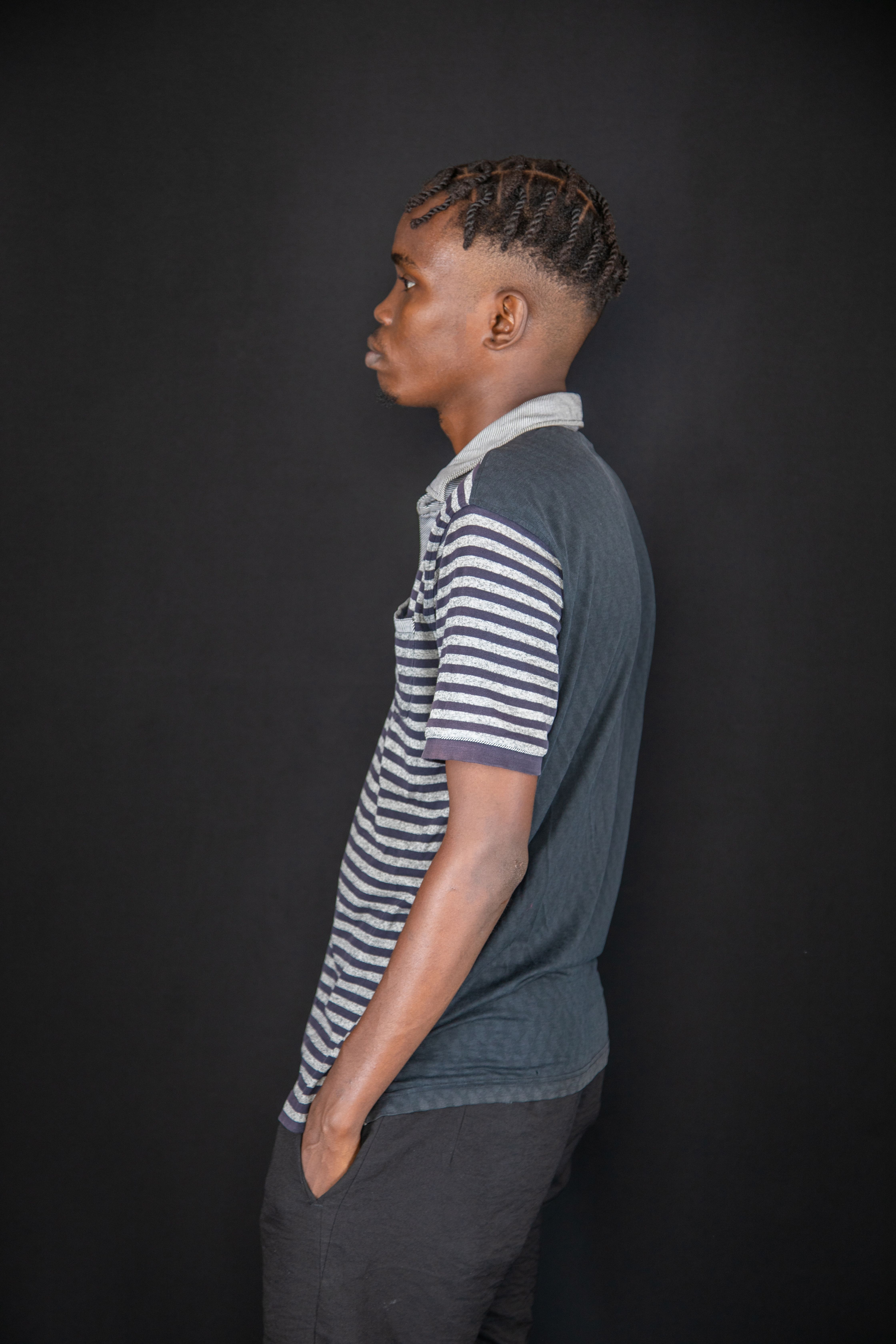 Profile Portrait of Man with Braided Hair · Free Stock Photo