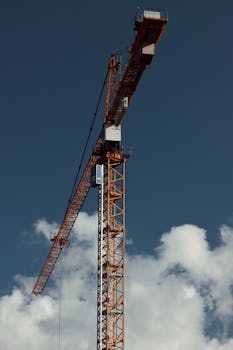 A construction crane against a cloudy sky in Gothenburg, Sweden.
