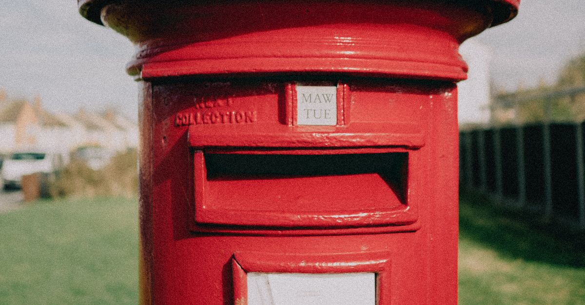 Classic Red British Post Box in Sunny Park · Free Stock Photo