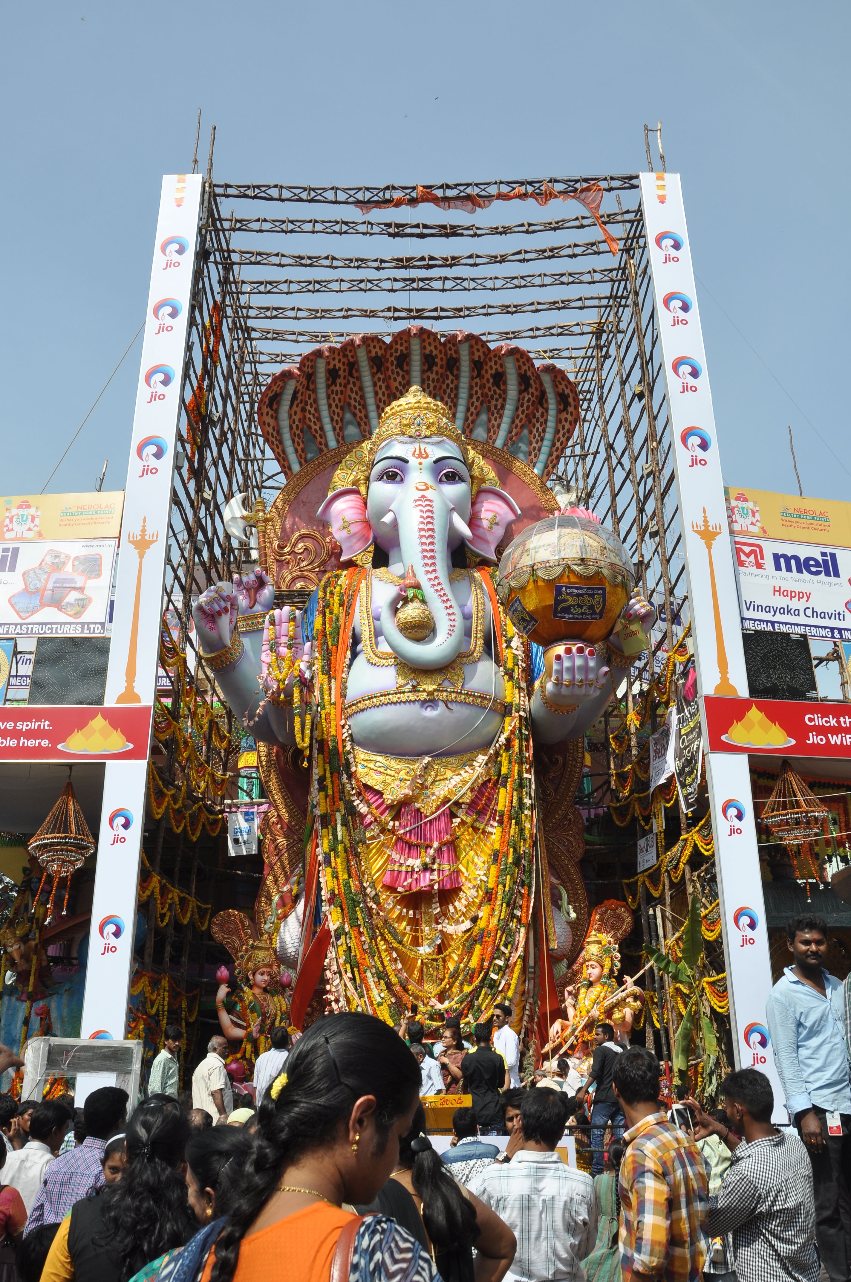 Large Ganesha statue with vibrant decorations during Vinayaka Chavithi festival in India.