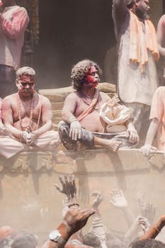 Colorful celebration during Masaan Holi festival in Varanasi, India, showcasing cultural traditions.