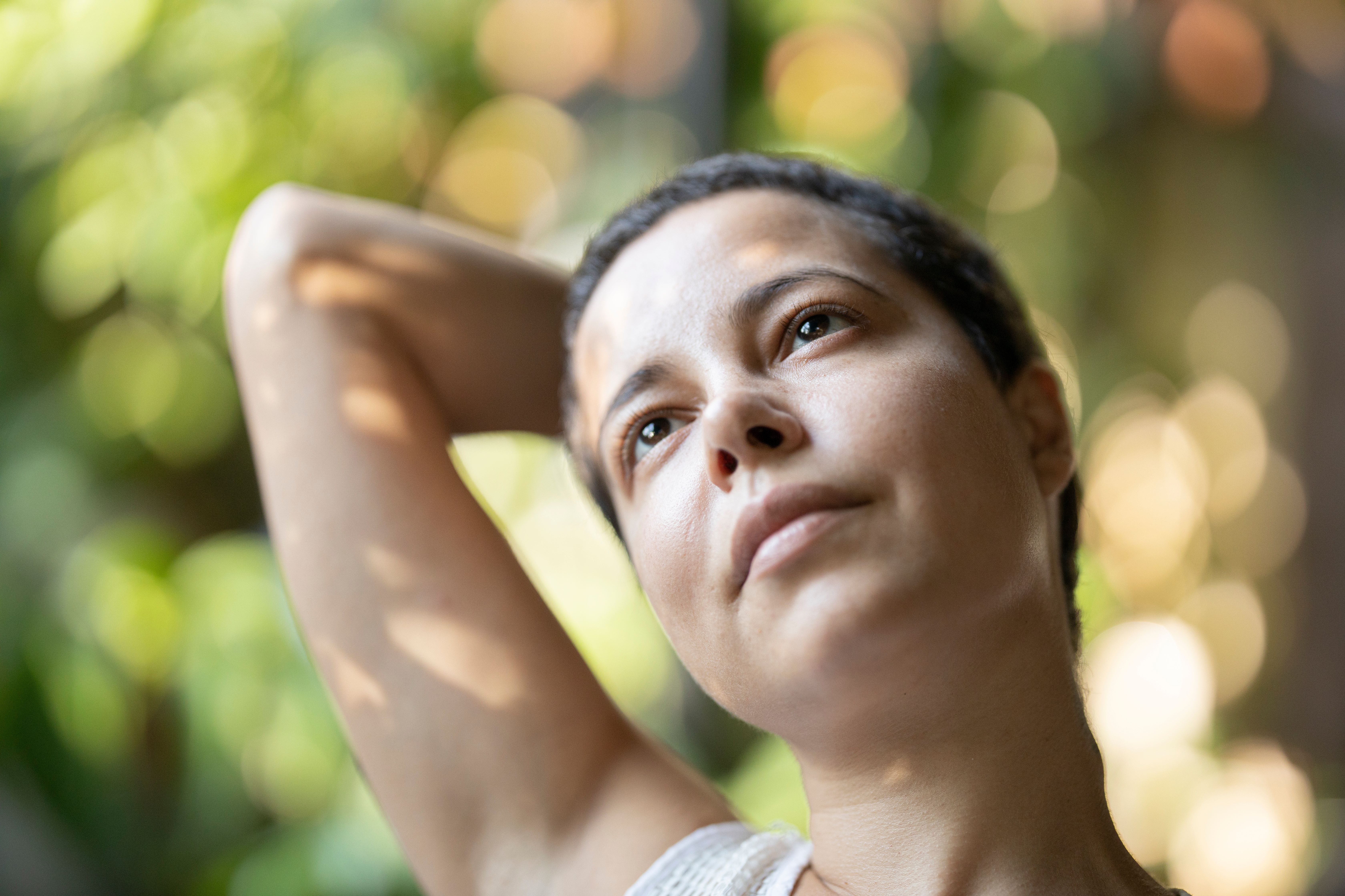Close-up portrait capturing serenity and beauty with a soft bokeh effect.