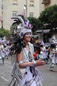 Colorful costumes and lively atmosphere at Badajoz carnival parade.