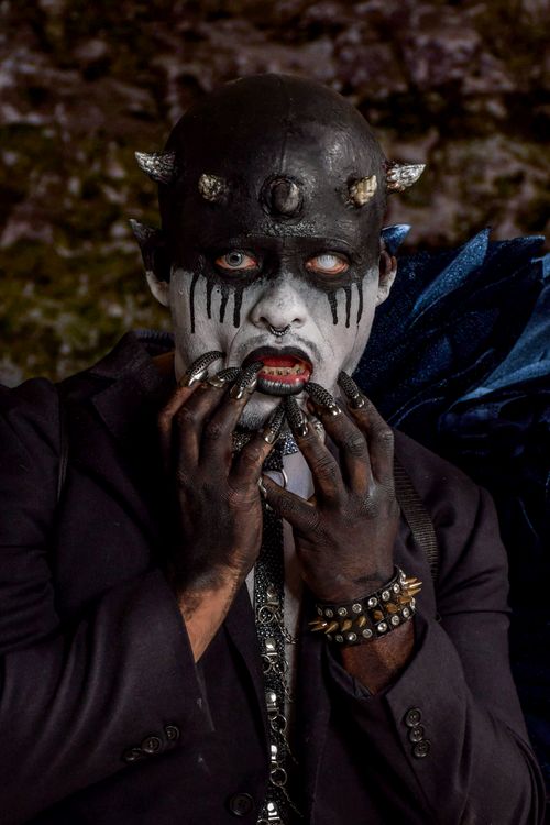 Free Dramatic depiction of a person in a demon mask and dark costume, ideal for Halloween or fantasy themes. Stock Photo
