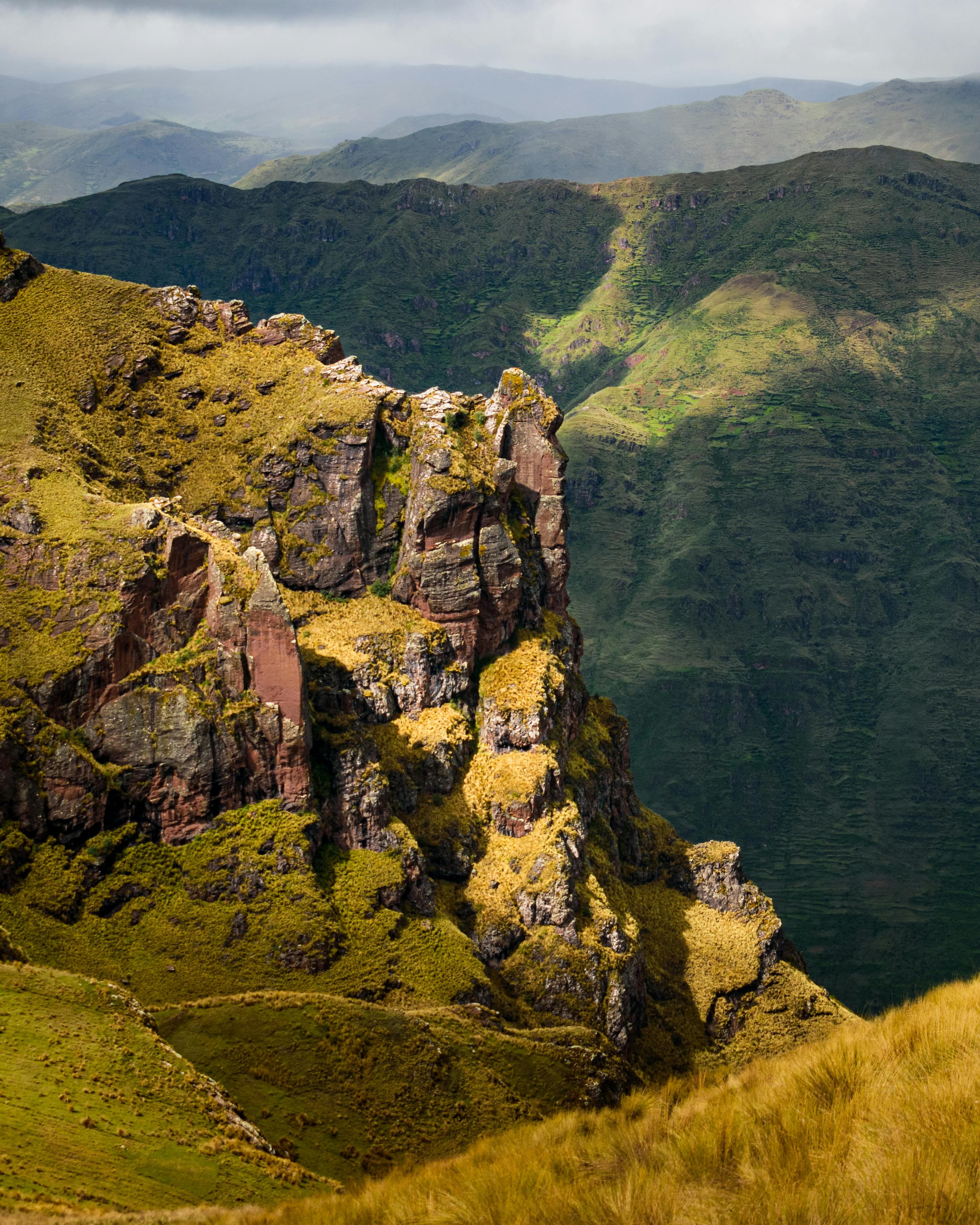 Breathtaking view of Pisac's rugged terrain and lush greenery in the Andes.
