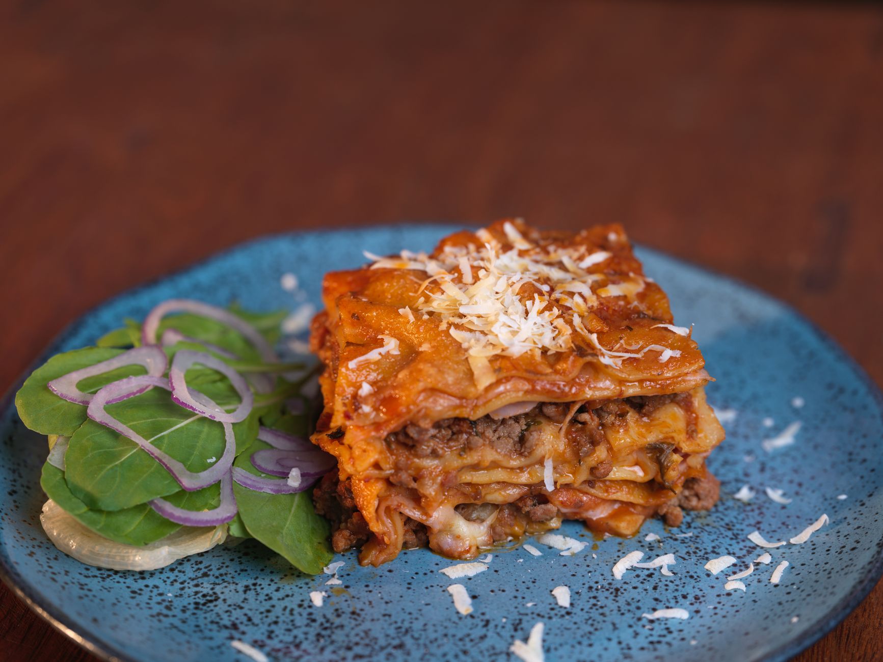 Close up of creamy chicken spinach lasagna slice