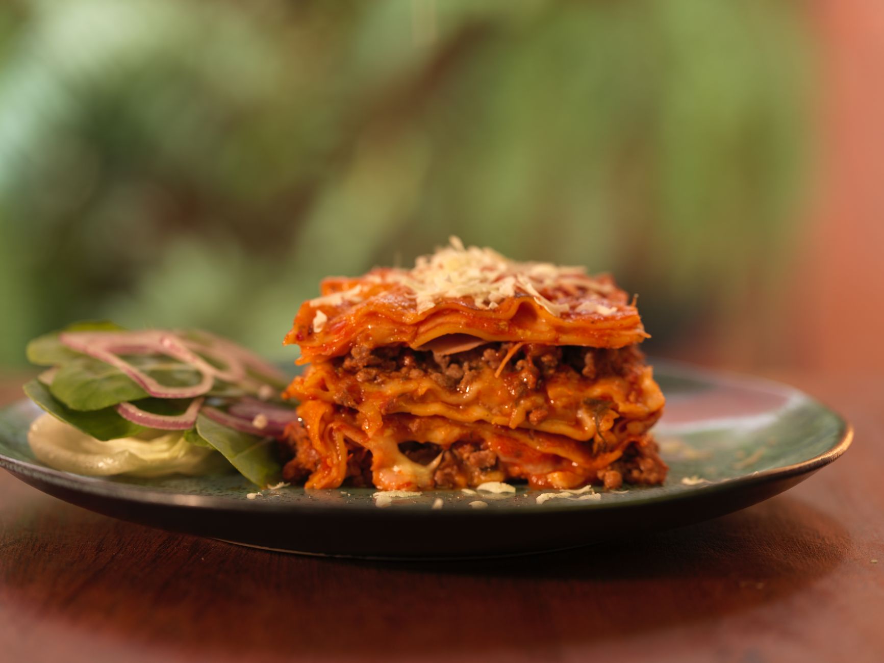 Close-up of layered vegetable and lean protein casserole with melted cheese