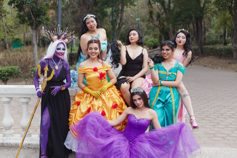 A colorful group of friends in fantasy costumes having fun at a fairytale-themed event