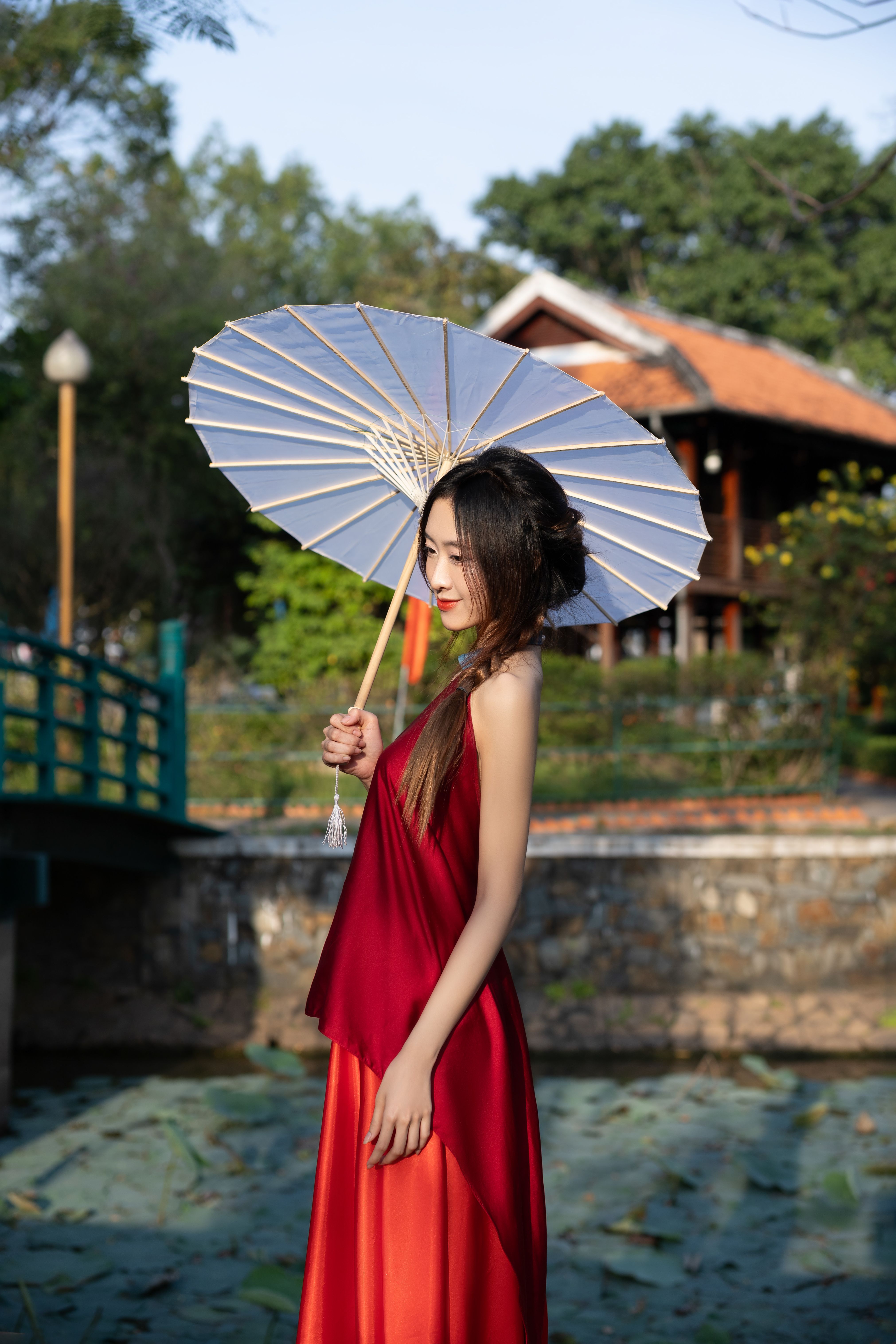 Elegant Woman in Red Dress with Parasol Outdoors · Free Stock Photo