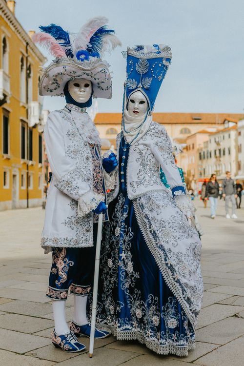 Free Elegant Venetian masks and costumes at the Carnival in Venice. Stock Photo
