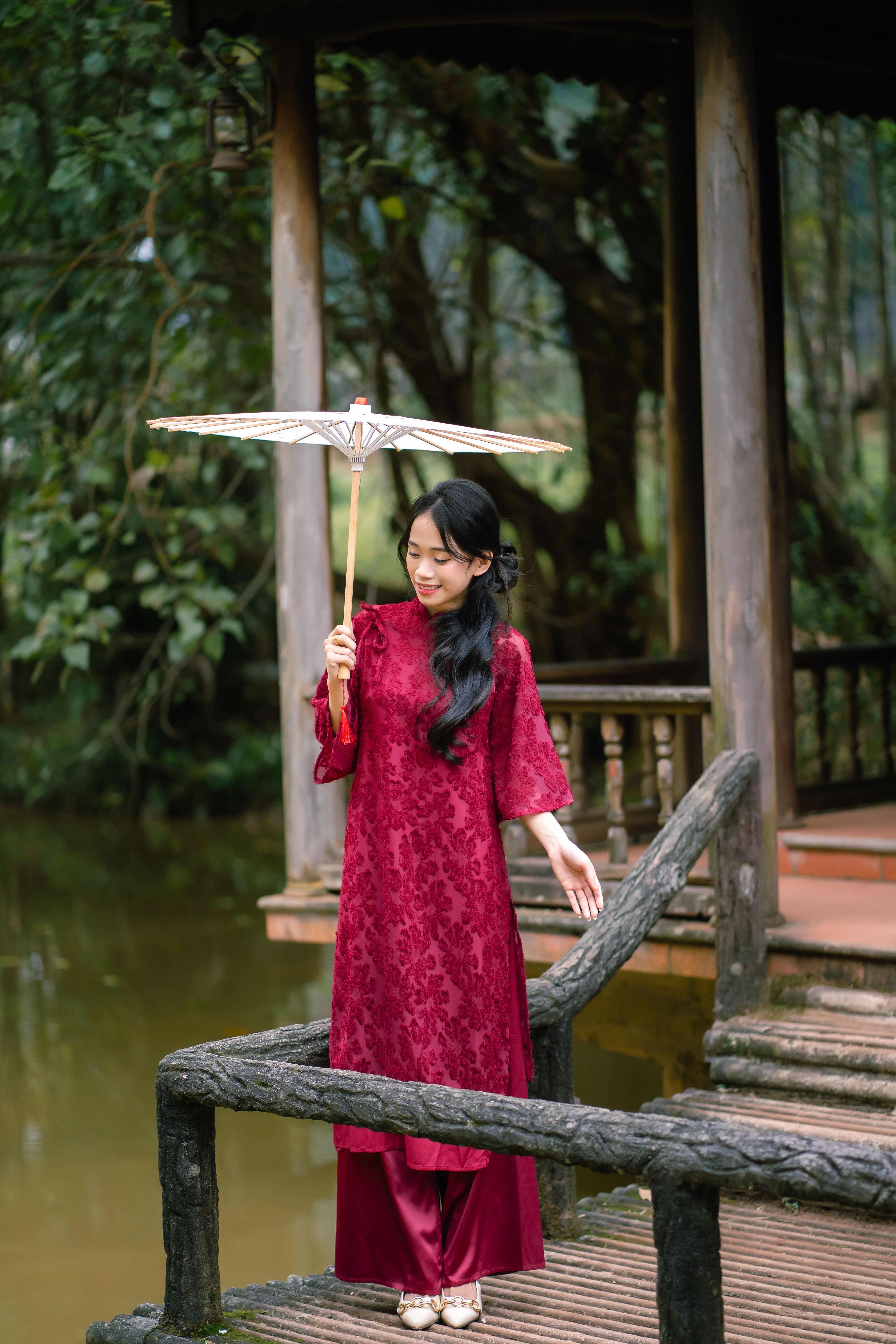 Elegant Woman in Traditional Red Dress with Umbrella  Free Stock Photo