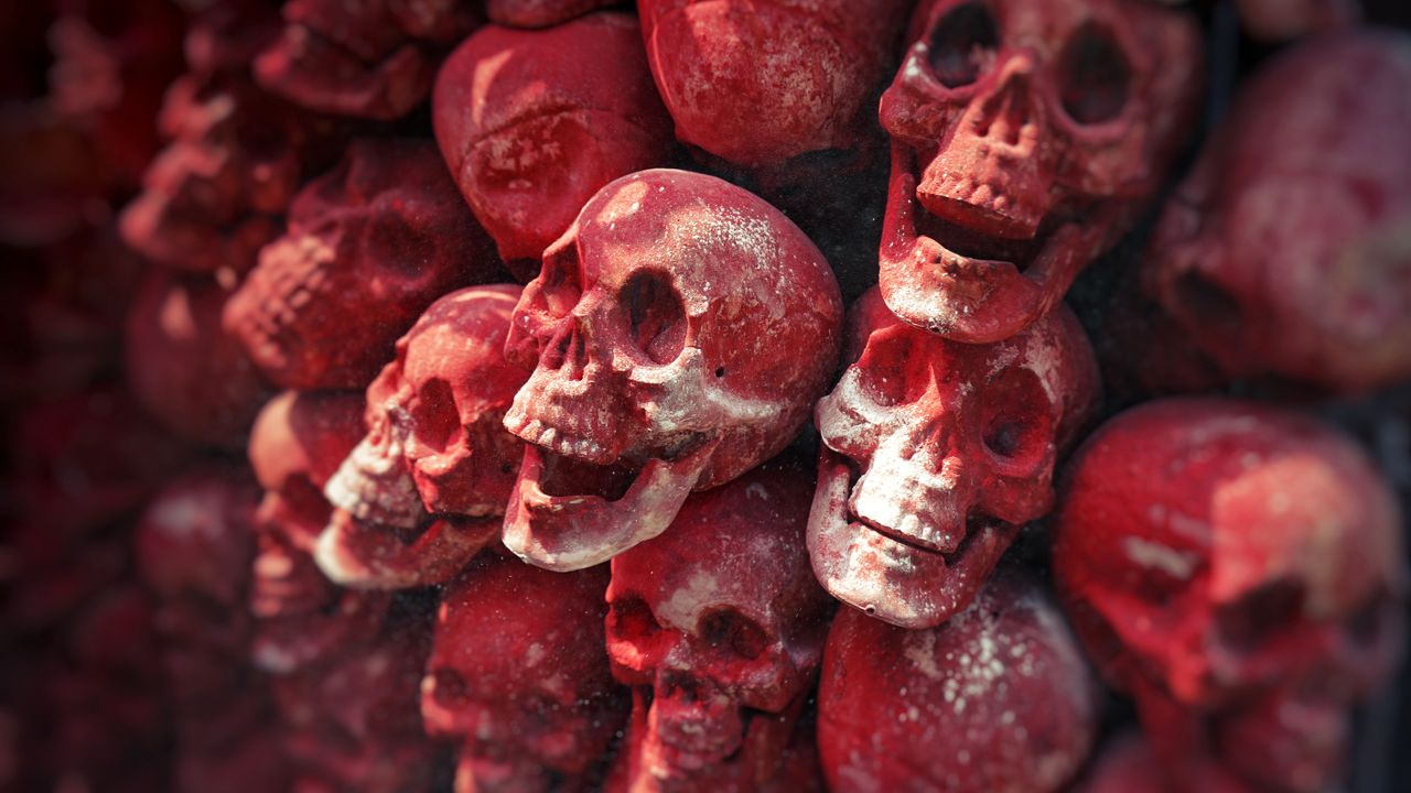 close up view of a red skull art installation showcasing vivid texture