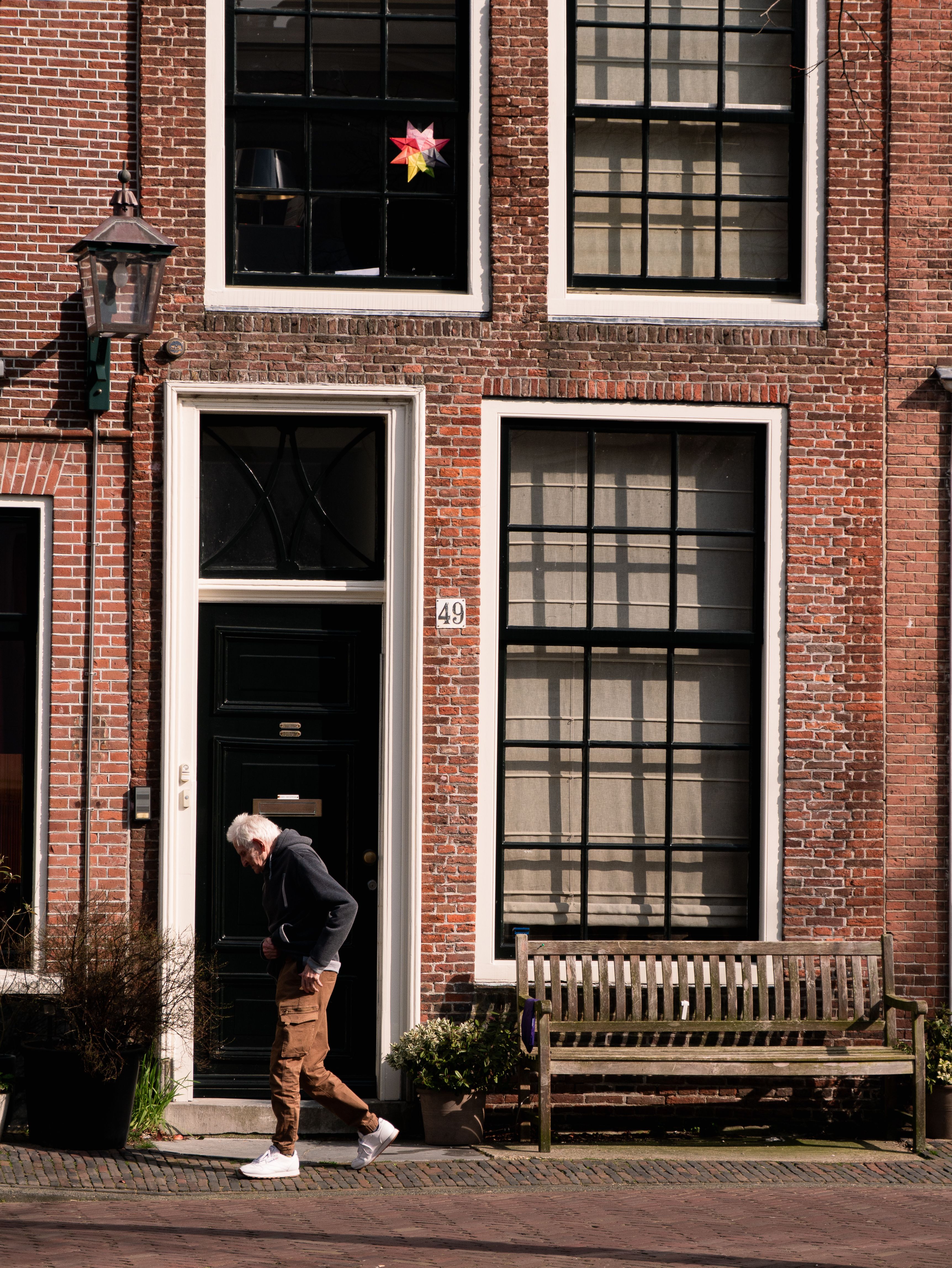 Charming street view of a traditional Dutch building in Haarlem, Netherlands.