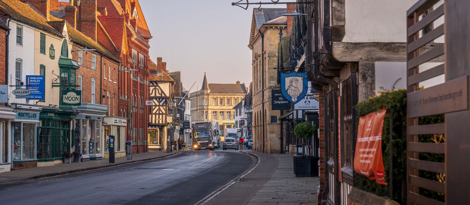 Picturesque street scene in Stratford-upon-Avon, England showcasing charming architecture at dusk.
