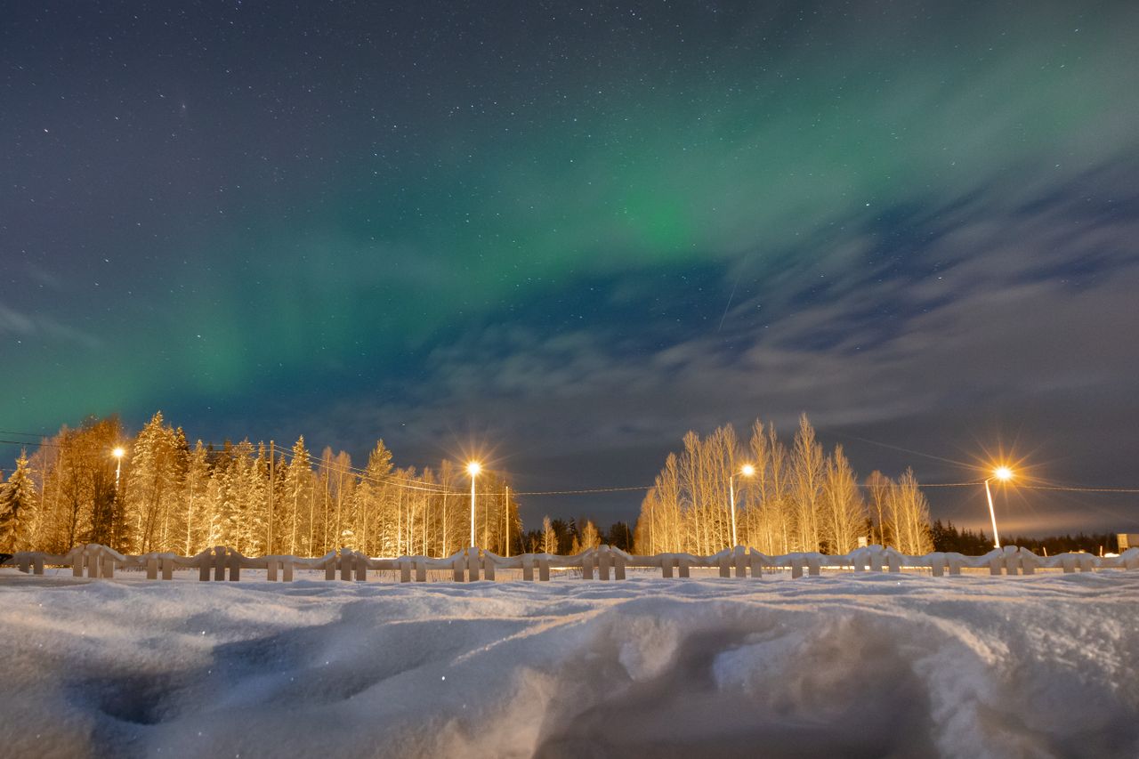 stunning northern lights illuminate a snowy night sky in lapland finla