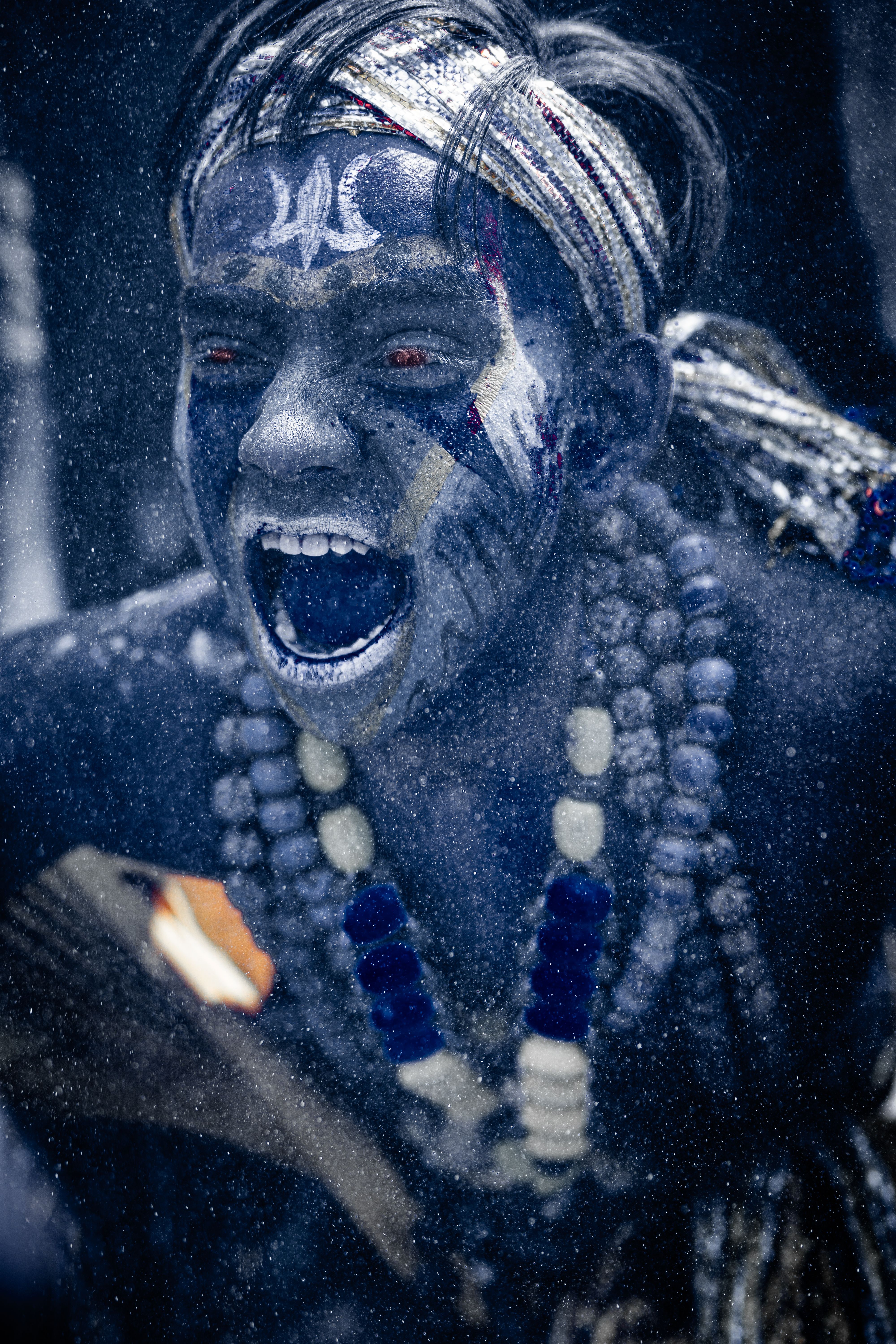 A culturally rich portrayal of Masaan Holi festival in Varanasi, India, showcasing traditional attire and expressions.