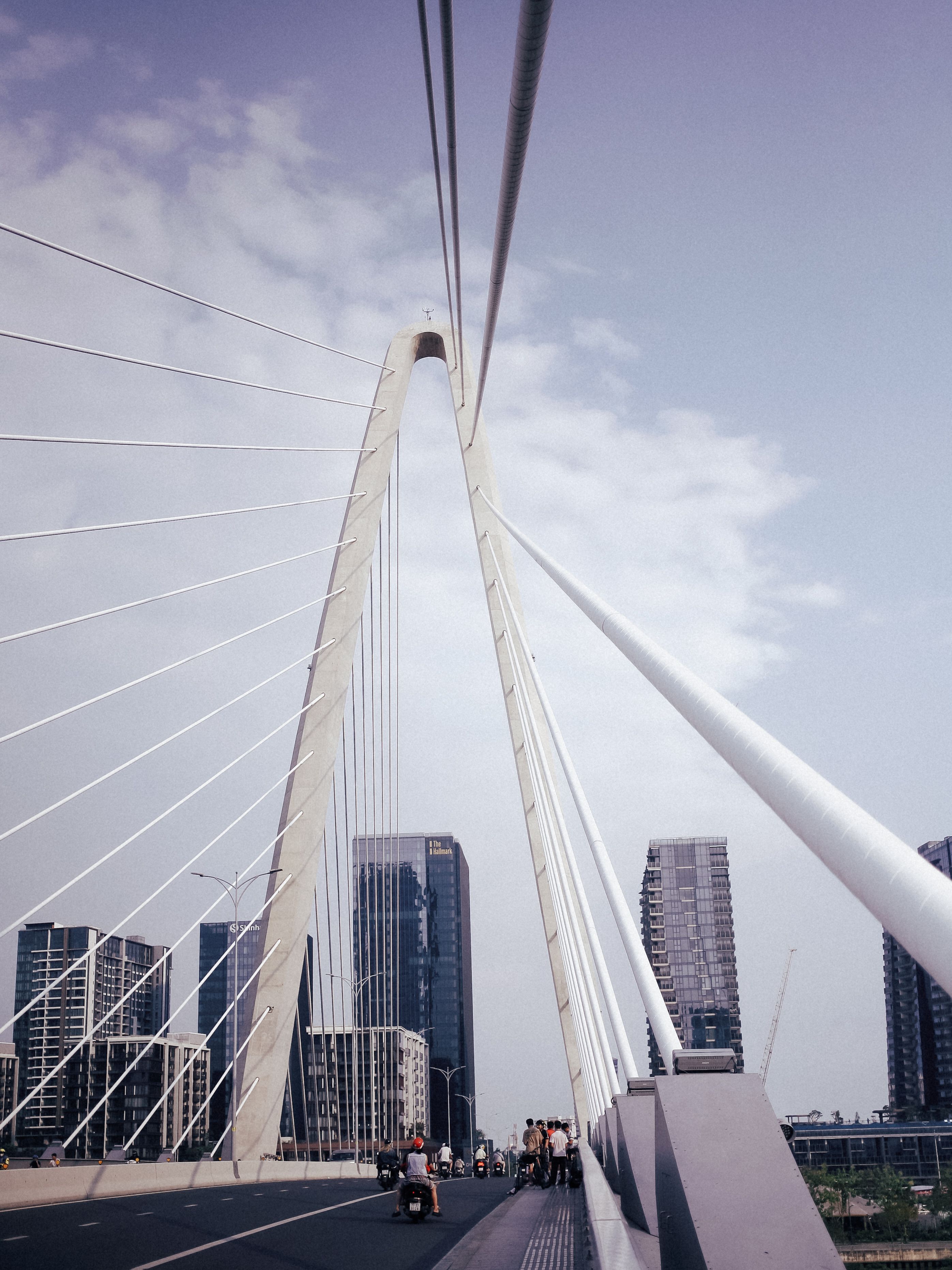 Modern Suspension Bridge with City Skyline · Free Stock Photo