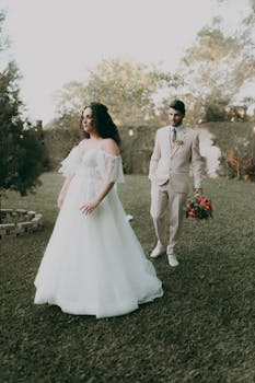 Newlyweds enjoying a serene outdoor garden wedding ceremony.