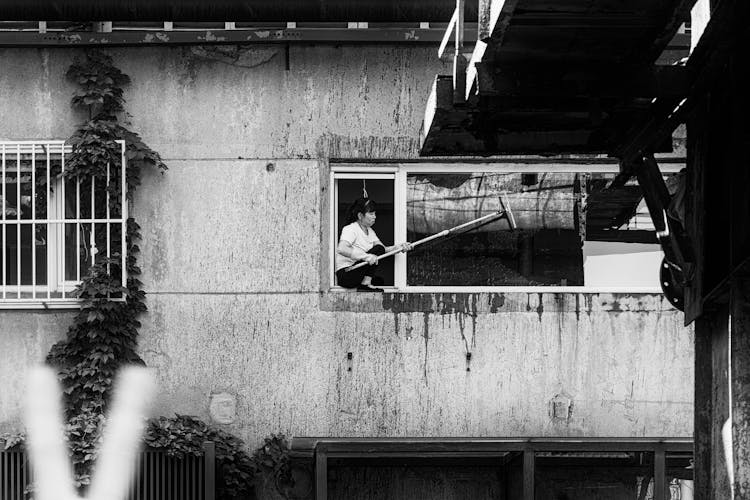 Woman Cleaning Window