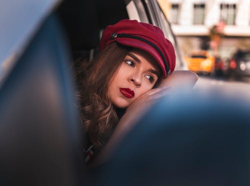 Photo Of Woman Leaning On Car Window