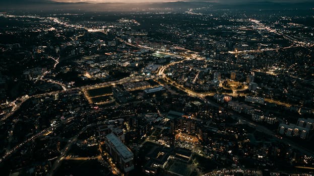 A breathtaking aerial view of Pristina city lights illuminating the night landscape.