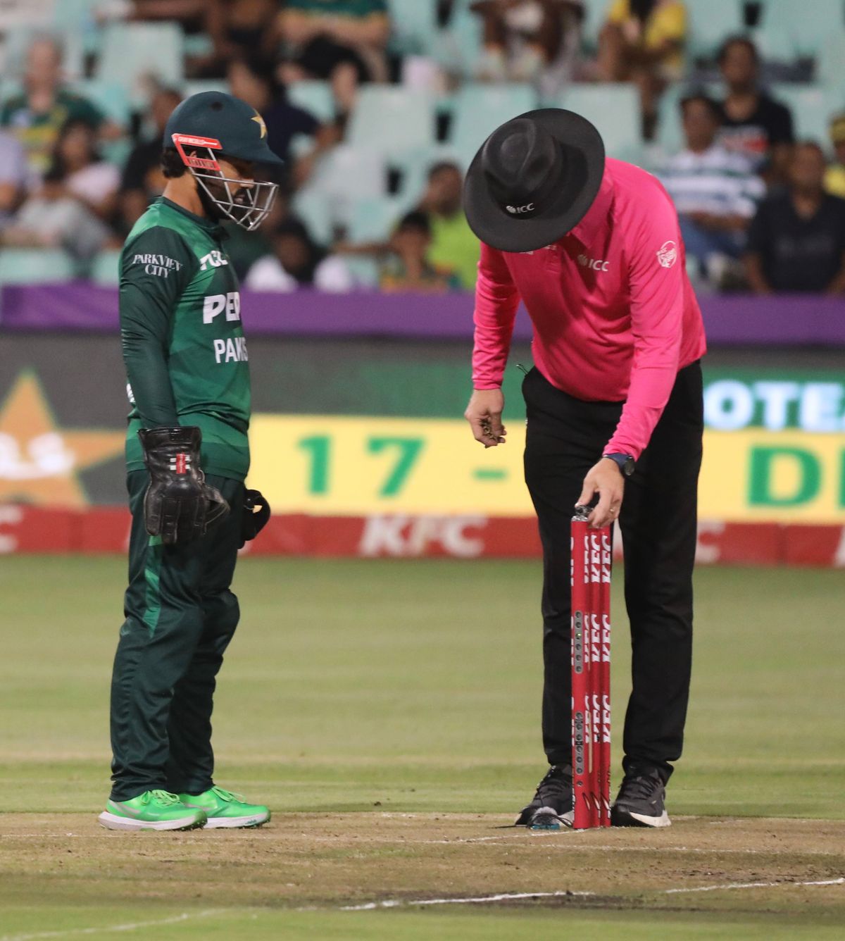 An umpire officiating a cricket match
