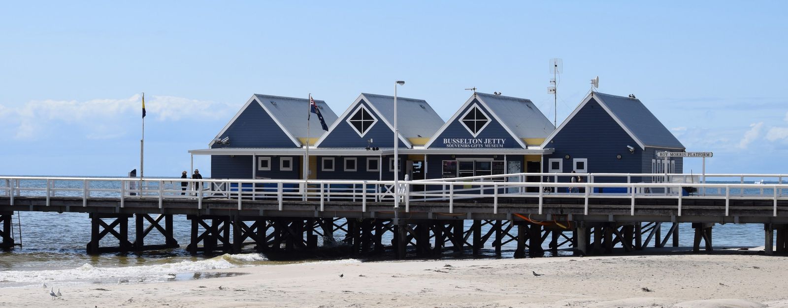 Explore the iconic Busselton Jetty in Western Australia on a sunny day, overlooking the ocean.