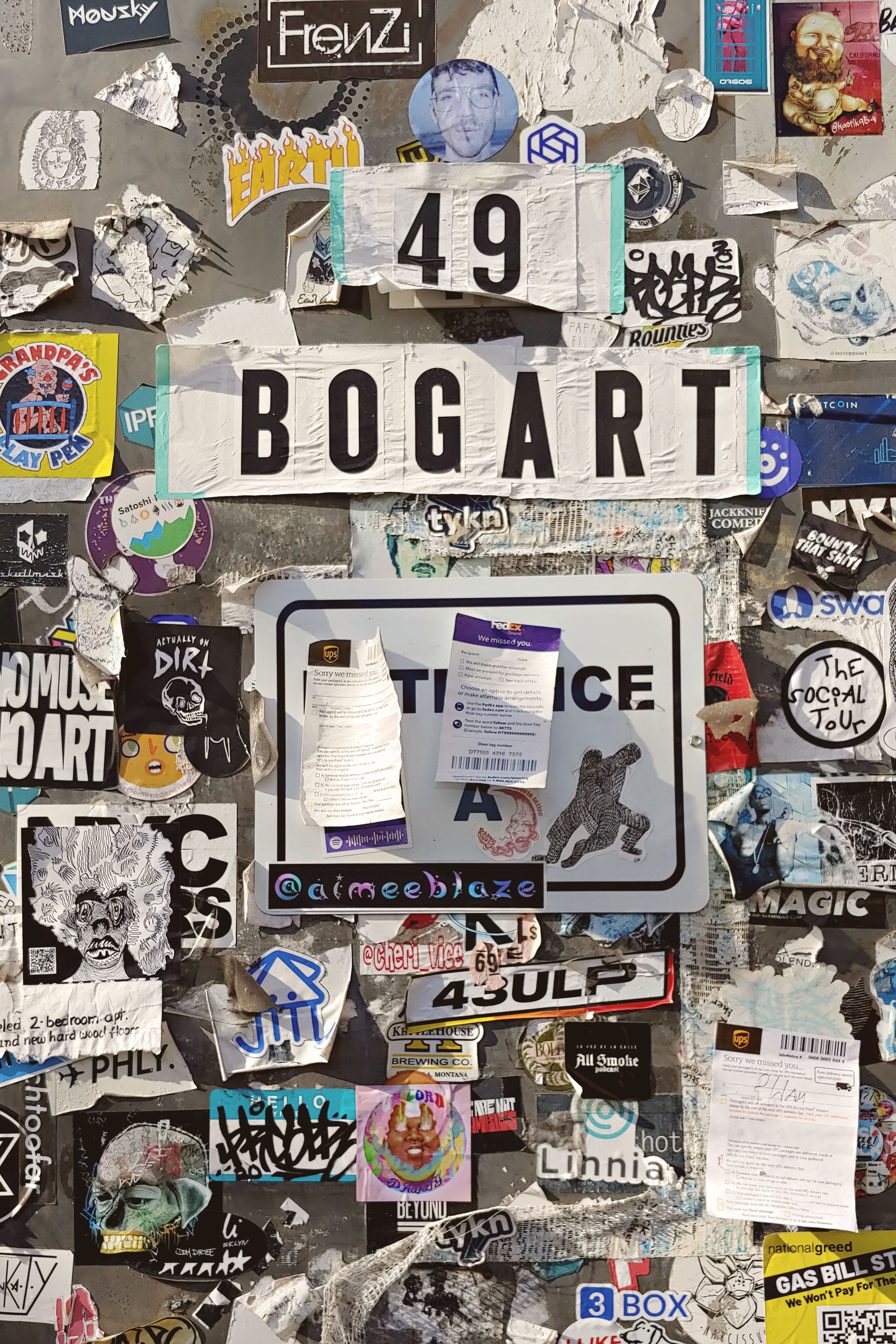 Colorful collection of street art and stickers in Bogart Street, Brooklyn.
