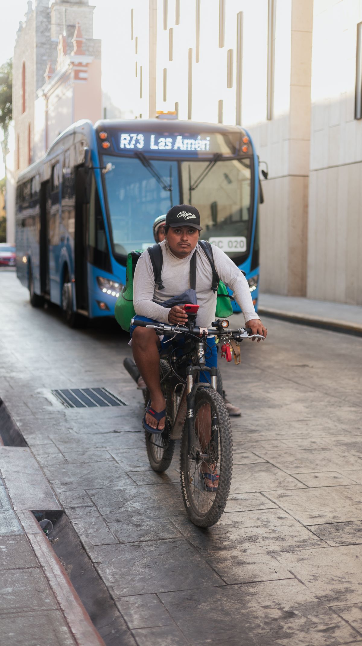 Urban cyclist riding through a city street