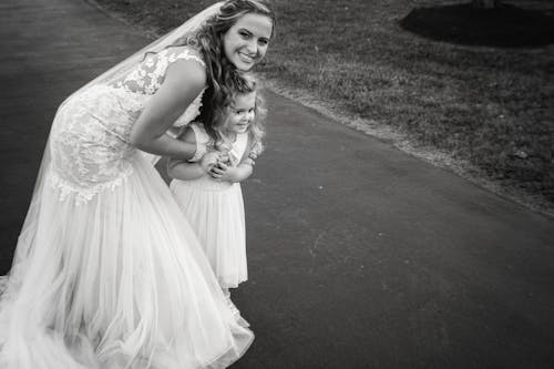 Free stock photo of bride, flower girl, hug