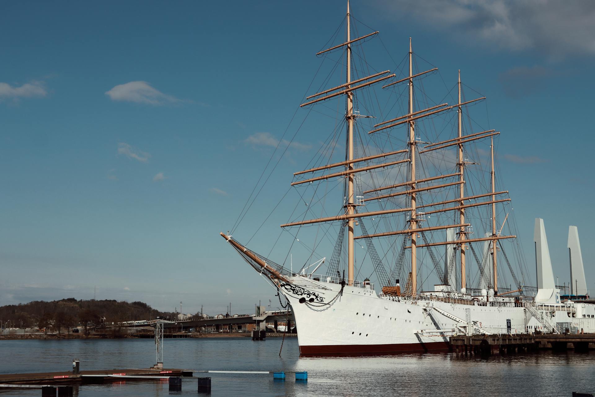 A stunning tall ship moored in the harbor of Gothenburg, Sweden, on a clear day.